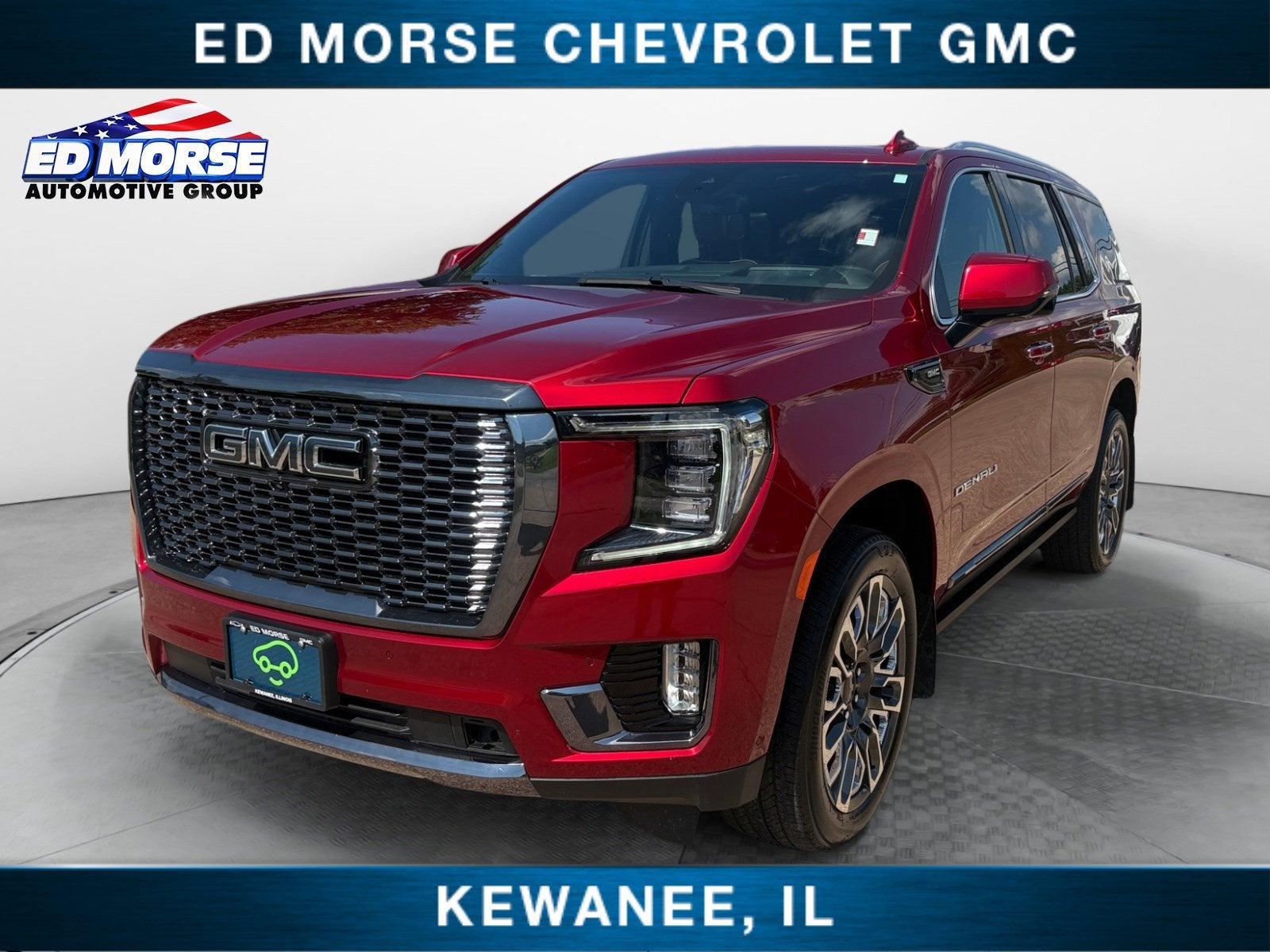 2024 GMC Yukon Denali Ultimate in Volcanic Red Tintcoat — front three-quarter view