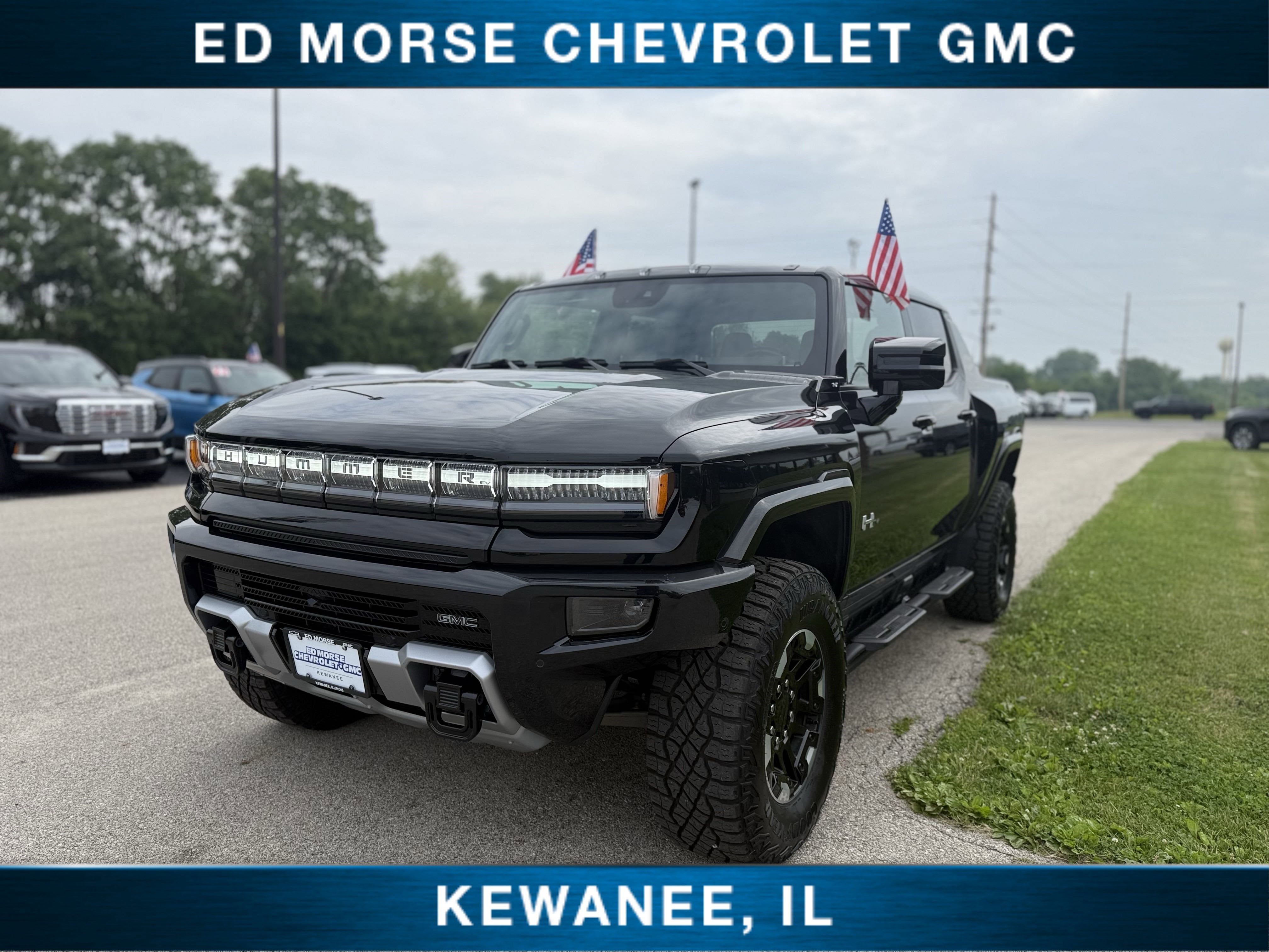 2025 GMC HUMMER EV Pickup 3X in Void Black — front three-quarter view