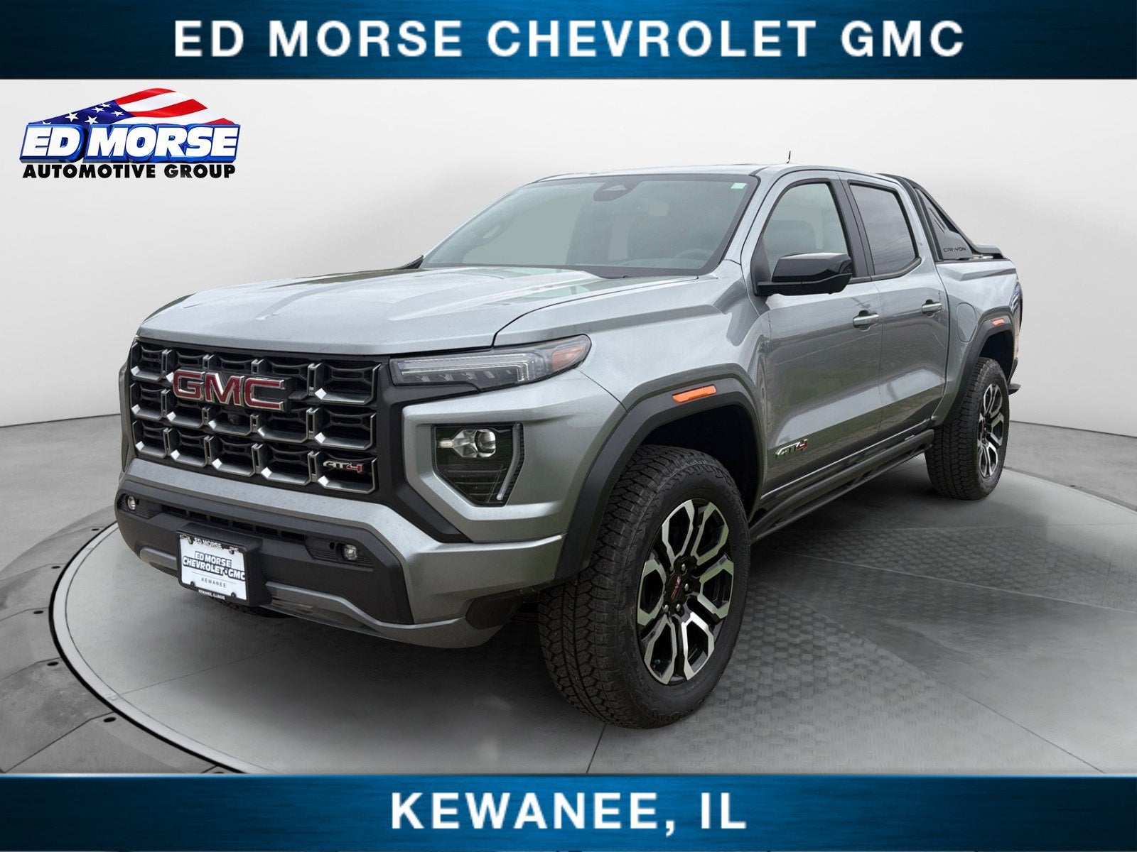 2025 GMC Canyon AT4 in Sterling Metallic — front three-quarter view
